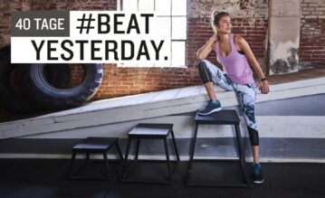 Sportlerin steht im Fitnessstudio bei der #40TageBeatYesterday Challenge